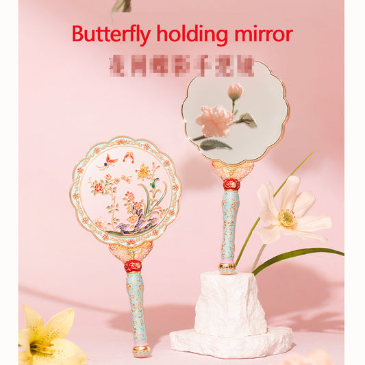 Butterfly holding mirror