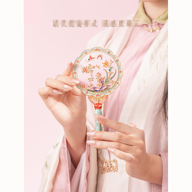 Butterfly holding mirror