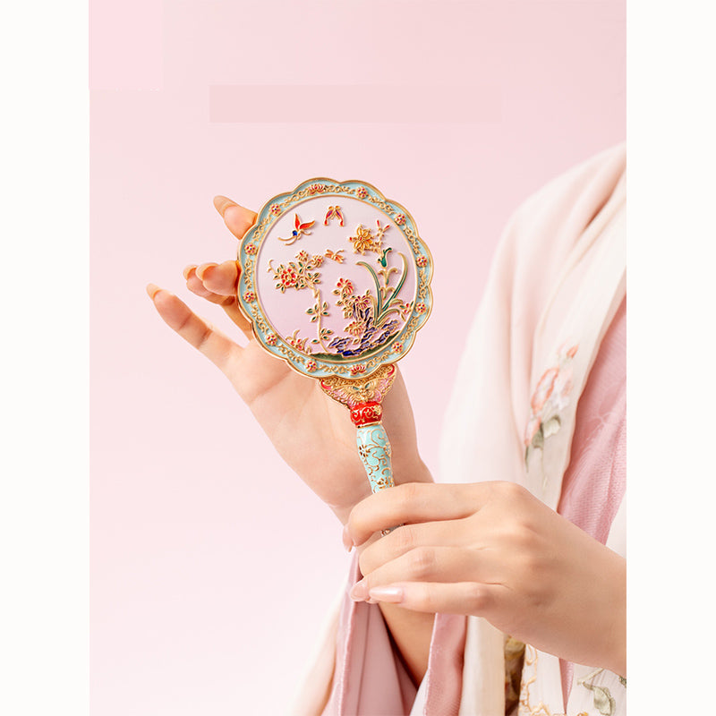 Butterfly holding mirror